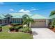 Single-story home with a green roof and landscaped yard at 1519 Atares Dr # 112, Punta Gorda, FL 33950