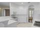 White kitchen with an L-shaped counter and modern appliances at 1519 Atares Dr # 112, Punta Gorda, FL 33950