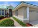 Home exterior showcasing landscaping and a two-car garage at 1519 Atares Dr # 112, Punta Gorda, FL 33950