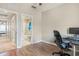 Spacious home office with wood flooring, window, and desk at 1186 Rio De Janeiro Ave # 104, Punta Gorda, FL 33983