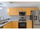 Modern kitchen with stainless steel appliances and granite countertops at 1186 Rio De Janeiro Ave # 104, Punta Gorda, FL 33983