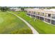 Ground-level view of condo building near the golf course at 1186 Rio De Janeiro Ave # 104, Punta Gorda, FL 33983