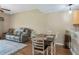 Cozy dining area with wood floors and access to the living room at 1186 Rio De Janeiro Ave # 104, Punta Gorda, FL 33983