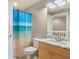 Bright bathroom with granite countertop and shower at 1186 Rio De Janeiro Ave # 104, Punta Gorda, FL 33983