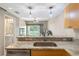 Kitchen with granite countertops, stainless steel appliances, and breakfast bar at 1186 Rio De Janeiro Ave # 104, Punta Gorda, FL 33983