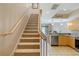 Interior stairs leading to the upper level from the kitchen area at 1186 Rio De Janeiro Ave # 104, Punta Gorda, FL 33983