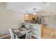Bright dining area with wood floors and kitchen views at 1186 Rio De Janeiro Ave # 104, Punta Gorda, FL 33983