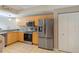 Bright kitchen featuring stainless steel appliances and light wood cabinets at 1186 Rio De Janeiro Ave # 104, Punta Gorda, FL 33983