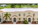 Exterior view of a multi unit building complex with parking and landscaping at 1186 Rio De Janeiro Ave # 104, Punta Gorda, FL 33983