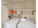 Convenient laundry room with side-by-side washer and dryer at 1186 Rio De Janeiro Ave # 104, Punta Gorda, FL 33983