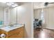 Bathroom with granite countertop, single sink vanity and toilet at 1186 Rio De Janeiro Ave # 104, Punta Gorda, FL 33983