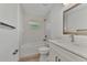 Updated bathroom with white cabinets and bathtub at 3847 E Price Blvd, North Port, FL 34288