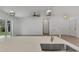 Kitchen island with quartz countertop and stainless steel sink at 3847 E Price Blvd, North Port, FL 34288