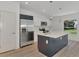 Modern kitchen with stainless steel appliances and an island at 3847 E Price Blvd, North Port, FL 34288