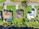 Aerial view of a single-Gathering home with a large backyard and surrounding houses at 1516 Natrona Dr, North Port, FL 34286