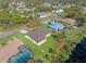 An aerial view showcasing a house near a canal and neighboring properties at 1516 Natrona Dr, North Port, FL 34286