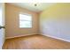 Simple bedroom with wood flooring and large window at 1516 Natrona Dr, North Port, FL 34286
