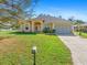 Single-story house with a two-car garage and a neatly landscaped yard at 1516 Natrona Dr, North Port, FL 34286