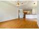 Living area with hardwood floors and kitchen access at 1516 Natrona Dr, North Port, FL 34286