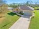 Single-story house with a two-car garage and well-maintained lawn at 1516 Natrona Dr, North Port, FL 34286