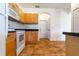 Kitchen boasts wood cabinets, tile floors and modern appliances at 1516 Natrona Dr, North Port, FL 34286