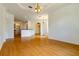 Open living room with hardwood floors and kitchen views at 1516 Natrona Dr, North Port, FL 34286