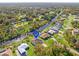 Aerial view of a single-Gathering home with a canal view at 1516 Natrona Dr, North Port, FL 34286