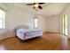 Spacious bedroom with wood floors and sliding glass doors leading to a patio at 1516 Natrona Dr, North Port, FL 34286