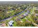 Aerial view of canal front property with a home at 1516 Natrona Dr, North Port, FL 34286