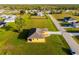 Aerial view of the property showing the house, driveway, landscaping, and the surrounding neighborhood at 16077 Coruna Ct, Punta Gorda, FL 33955