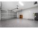 Garage featuring epoxy floors, an insulated door and a side entry door at 16077 Coruna Ct, Punta Gorda, FL 33955