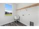 Laundry room features utility sink, window and shelving at 16077 Coruna Ct, Punta Gorda, FL 33955