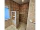 Walk-in shower with tile surround and built-in shelving at 2259 Ryan Blvd, Punta Gorda, FL 33950