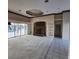 Spacious living area with a stone fireplace, built-in shelving and carpet flooring at 2259 Ryan Blvd, Punta Gorda, FL 33950