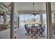 Screened-in patio with table and chairs, offering water views at 2259 Ryan Blvd, Punta Gorda, FL 33950