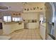 Bright kitchen with white cabinets, stainless steel appliances, and tile floors at 2259 Ryan Blvd, Punta Gorda, FL 33950