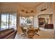 Casual breakfast nook with glass-top table and wicker chairs, overlooking pool at 2259 Ryan Blvd, Punta Gorda, FL 33950