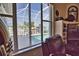 Stunning water view from large windows, showcasing pool and canal at 2259 Ryan Blvd, Punta Gorda, FL 33950