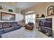 Gathering room with jukebox, leather seating, and large-screen TV at 2259 Ryan Blvd, Punta Gorda, FL 33950