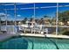 Enclosed pool with a view of canal and boat at 2259 Ryan Blvd, Punta Gorda, FL 33950