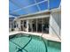 Enclosed pool area with patio and view of the canal at 2259 Ryan Blvd, Punta Gorda, FL 33950