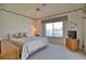 Spacious bedroom with a large bed, TV, and ample natural light at 2259 Ryan Blvd, Punta Gorda, FL 33950