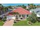 House with red tile roof and landscaped yard at 2259 Ryan Blvd, Punta Gorda, FL 33950