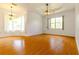 Empty dining room featuring hardwood floors and a chandelier at 1516 Natrona Dr, North Port, FL 34286