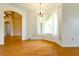 Bright dining room with hardwood floors and bay window at 1516 Natrona Dr, North Port, FL 34286