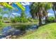 Peaceful view of a canal with lush greenery at 1516 Natrona Dr, North Port, FL 34286