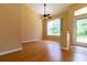 Spacious dining area with hardwood floors and large windows at 1516 Natrona Dr, North Port, FL 34286