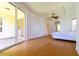 Bright bedroom with wood floors and access to a private patio at 1516 Natrona Dr, North Port, FL 34286