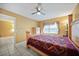 Bedroom with a wooden bed frame and ceiling fan at 25050 Sandhill Blvd # A4 Bldg 2, Punta Gorda, FL 33983