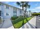 Condo building exterior with walkway and landscaping at 25050 Sandhill Blvd # A4 Bldg 2, Punta Gorda, FL 33983